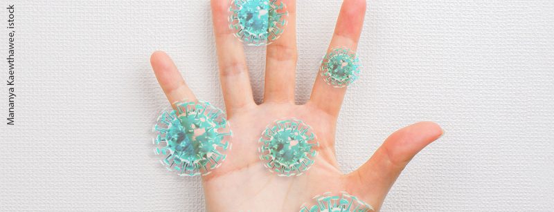 corona_hand_istock-1221120512